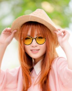 Woman wearting tinted round glasses