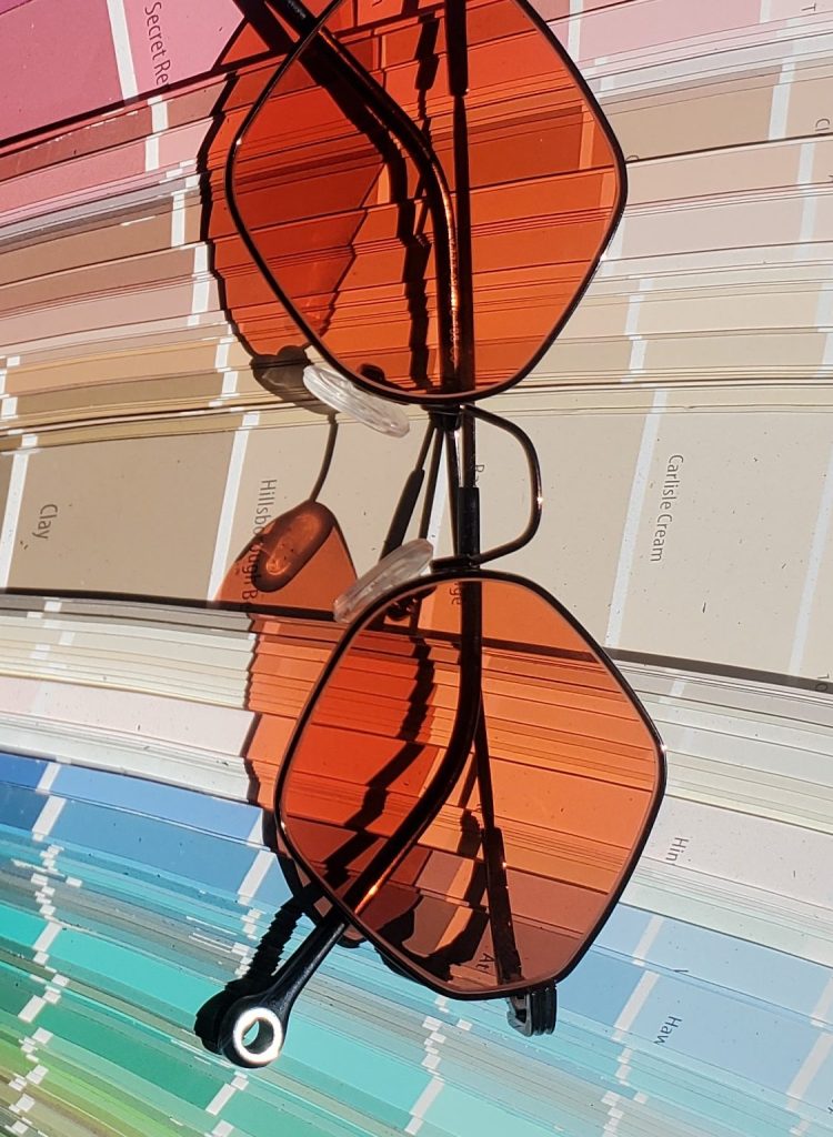 Hex shaped frames - small in black with orange tint