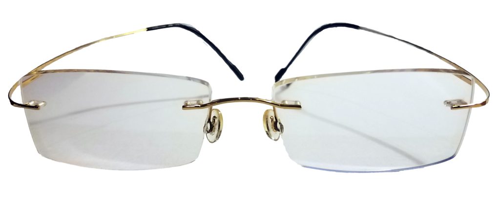 Rimless gold glasses with hingless arms with rectangular shape lenses